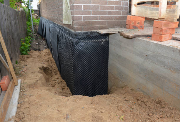 Happy homeowners after waterproofing job in Irvington